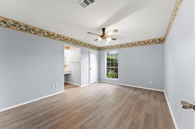 9310 Carvel Ln, Houston, TX 77036 - spare room with wood finished floors and a ceiling fan
