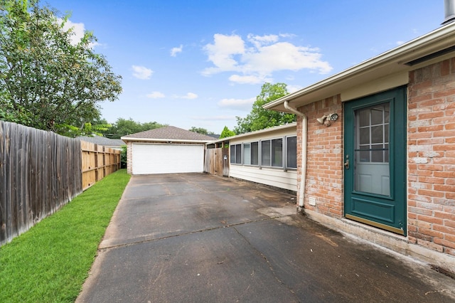 9310 Carvel Ln, Houston, TX 77036 - view of patio / terrace with an outbuilding and a garage