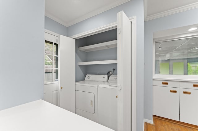 9310 Carvel Ln, Houston, TX 77036 - laundry room featuring independent washer and dryer, ornamental molding, light wood finished floors, and recessed lighting