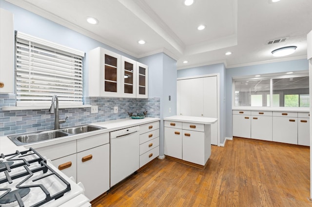9310 Carvel Ln, Houston, TX 77036 - kitchen with dishwasher, wood-type flooring, crown molding, recessed lighting, and decorative backsplash