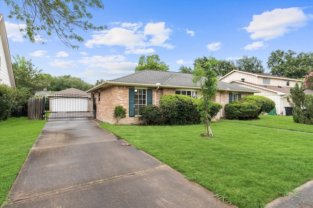 9310 Carvel Ln, Houston, TX 77036 - view of front of house featuring a gate, brick siding, a front yard, and roof with shingles