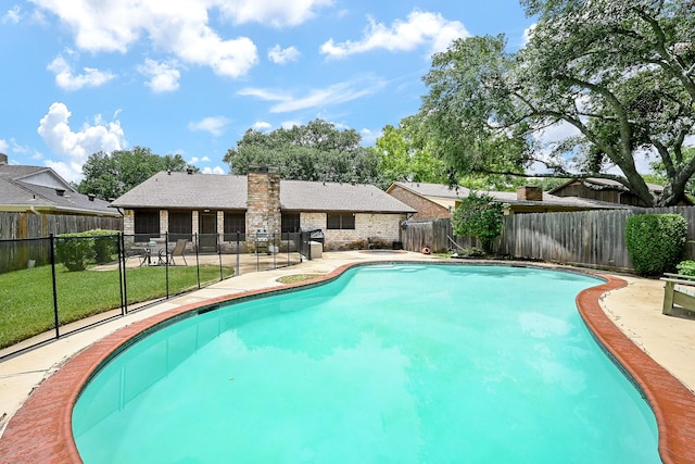 2563 Buffalo Trl, Sugar Land, TX 77479 - view of swimming pool with a fenced backyard and a patio area