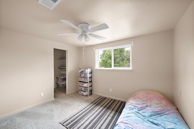 741 Rutgers Ln, Deer Park, TX 77536 - bedroom featuring carpet flooring, a walk in closet, a ceiling fan, and a closet