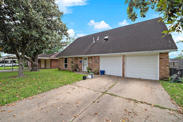 741 Rutgers Ln, Deer Park, TX 77536 - view of front of home featuring brick siding, a front lawn, roof with shingles, an attached garage, and driveway