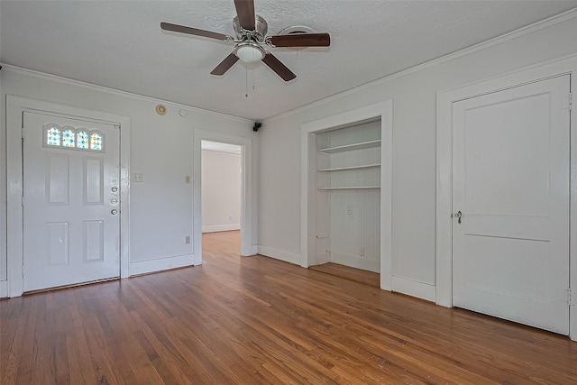 227 Lakeview Dr, Sugar Land, TX 77498 - foyer featuring ornamental molding, wood finished floors, ceiling fan, and a textured ceiling