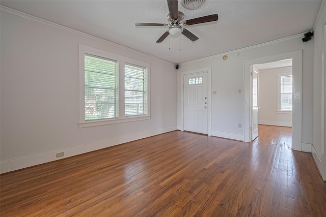227 Lakeview Dr, Sugar Land, TX 77498 - foyer entrance featuring healthy amount of natural light, ornamental molding, wood finished floors, and ceiling fan