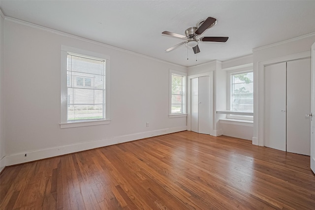 227 Lakeview Dr, Sugar Land, TX 77498 - unfurnished bedroom with two closets, light wood finished floors, ornamental molding, and ceiling fan