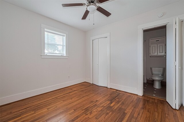 227 Lakeview Dr, Sugar Land, TX 77498 - unfurnished bedroom featuring wood finished floors, a closet, connected bathroom, and ceiling fan