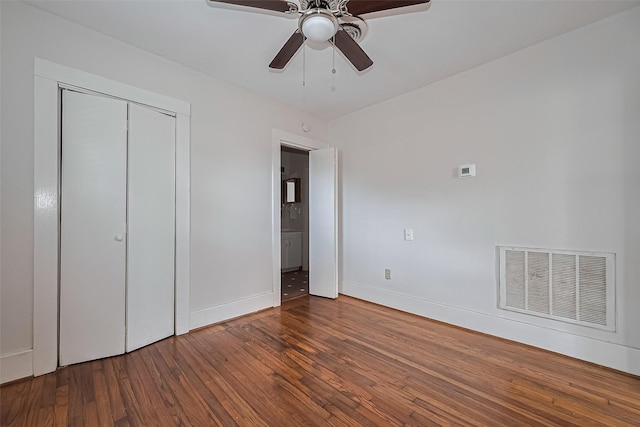 227 Lakeview Dr, Sugar Land, TX 77498 - unfurnished bedroom featuring wood finished floors, a closet, and a ceiling fan