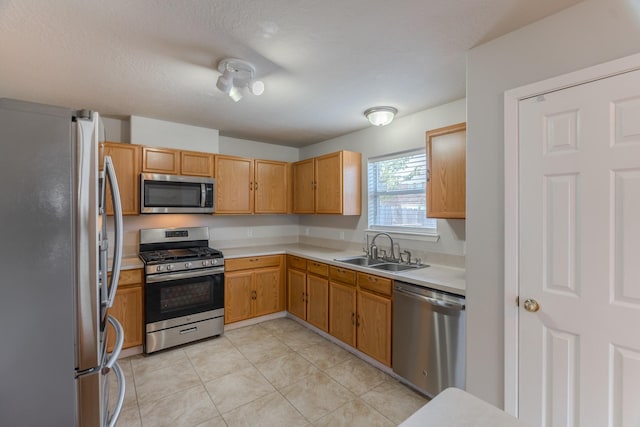 17203 Morning Blossom Pl, Houston, TX 77084 - kitchen featuring stainless steel appliances, light countertops, and light tile patterned floors