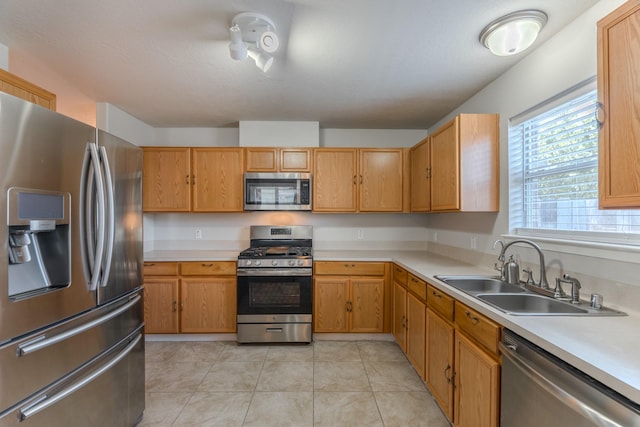 17203 Morning Blossom Pl, Houston, TX 77084 - kitchen featuring stainless steel appliances, light countertops, and light tile patterned floors