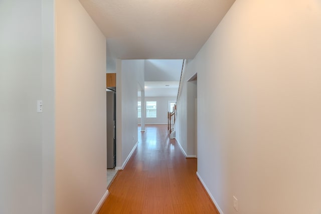 17203 Morning Blossom Pl, Houston, TX 77084 - hall with light wood finished floors and baseboards