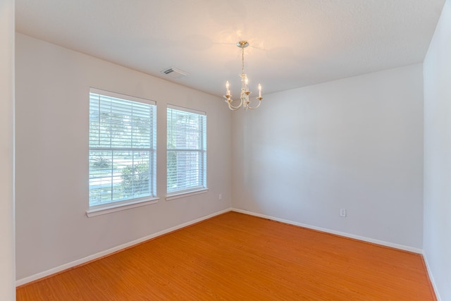 17203 Morning Blossom Pl, Houston, TX 77084 - empty room featuring a chandelier and light wood-style floors