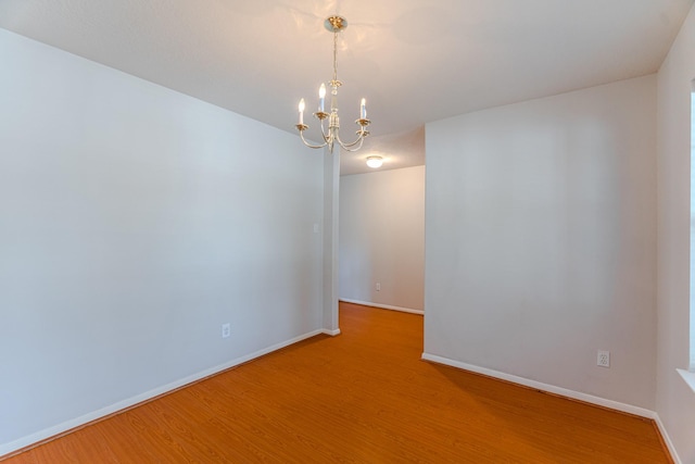 17203 Morning Blossom Pl, Houston, TX 77084 - unfurnished room featuring light wood finished floors and a chandelier