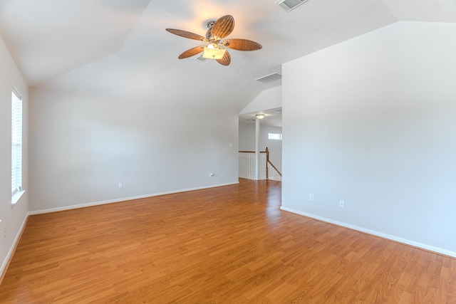 17203 Morning Blossom Pl, Houston, TX 77084 - unfurnished room with vaulted ceiling, healthy amount of natural light, ceiling fan, and light wood-style flooring