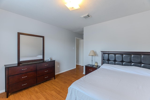 17203 Morning Blossom Pl, Houston, TX 77084 - bedroom with light wood-type flooring and baseboards