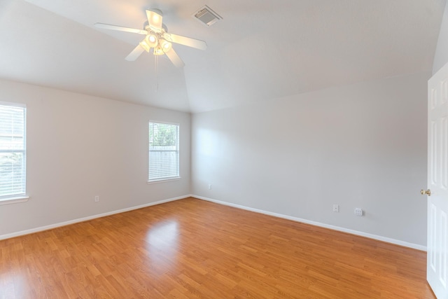 17203 Morning Blossom Pl, Houston, TX 77084 - empty room featuring light wood-type flooring, lofted ceiling, and a ceiling fan