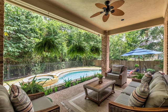 130 Amulet Oaks Ct, The Woodlands, TX 77382 - fenced backyard with an outdoor hangout area, a patio area, ceiling fan, and a pool with connected hot tub