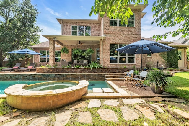 130 Amulet Oaks Ct, The Woodlands, TX 77382 - back of house featuring brick siding, ceiling fan, a patio, and a pool with connected hot tub