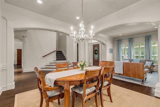 130 Amulet Oaks Ct, The Woodlands, TX 77382 - dining room featuring hardwood / wood-style floors, stairs, ornamental molding, recessed lighting, and arched walkways