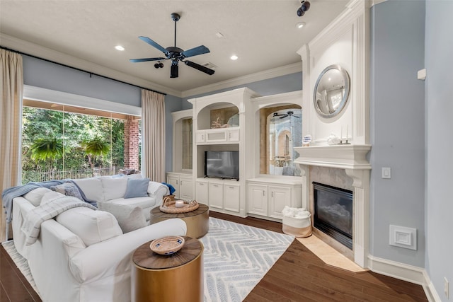 130 Amulet Oaks Ct, The Woodlands, TX 77382 - living room with ceiling fan, crown molding, dark wood-style floors, recessed lighting, and a high end fireplace