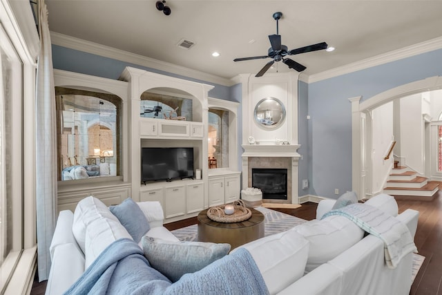 130 Amulet Oaks Ct, The Woodlands, TX 77382 - living area featuring dark wood-style floors, a ceiling fan, crown molding, recessed lighting, and a tiled fireplace