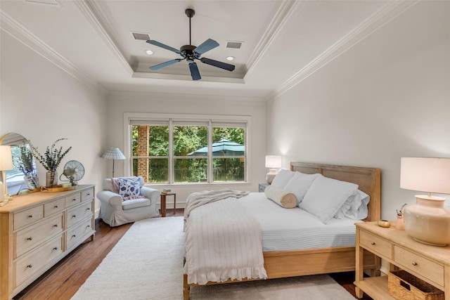 130 Amulet Oaks Ct, The Woodlands, TX 77382 - bedroom featuring a raised ceiling, wood finished floors, ornamental molding, ceiling fan, and recessed lighting