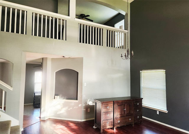 14631 Timber Cliff Ln, Cypress, TX 77429 - bedroom featuring hardwood / wood-style flooring, a high ceiling, and arched walkways