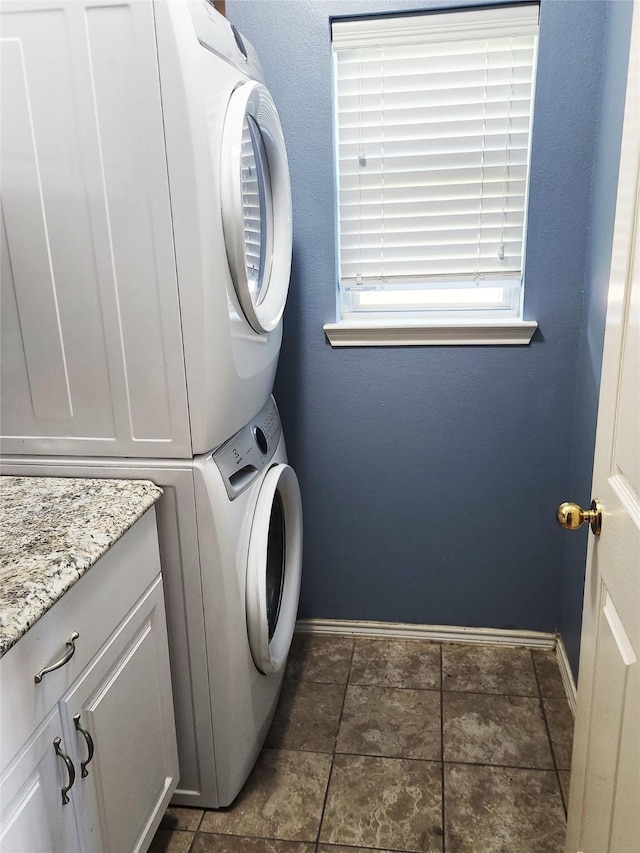 14631 Timber Cliff Ln, Cypress, TX 77429 - laundry area with estacked washer and dryer and cabinet space
