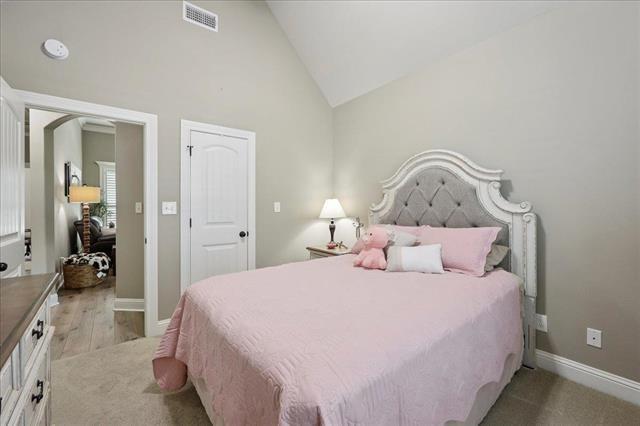 271 Hannah Ln, Lumberton, TX 77657 - bedroom with vaulted ceiling and baseboards