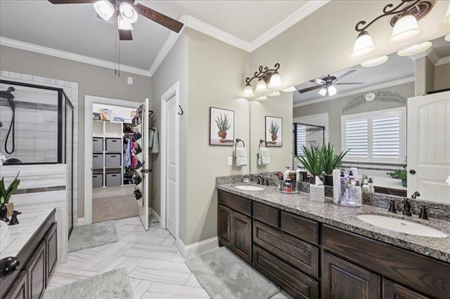 271 Hannah Ln, Lumberton, TX 77657 - full bath featuring a ceiling fan, ornamental molding, double vanity, a stall shower, and a walk in closet
