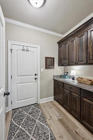271 Hannah Ln, Lumberton, TX 77657 - laundry area featuring crown molding and light wood-style floors