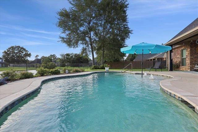 271 Hannah Ln, Lumberton, TX 77657 - view of swimming pool featuring a fenced backyard