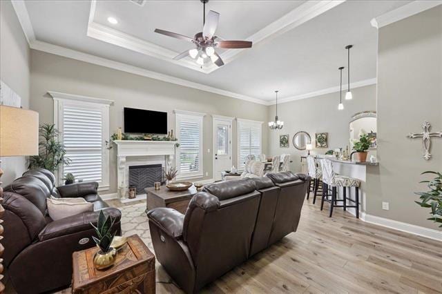 271 Hannah Ln, Lumberton, TX 77657 - living area featuring healthy amount of natural light, light wood-style flooring, a fireplace, ceiling fan, and crown molding