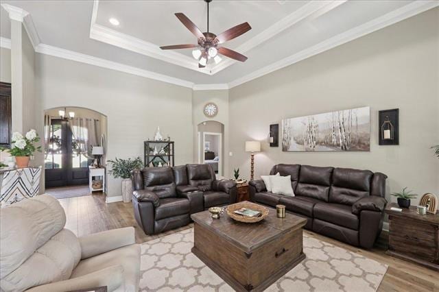 271 Hannah Ln, Lumberton, TX 77657 - living room with arched walkways, light wood-style flooring, a ceiling fan, and ornamental molding