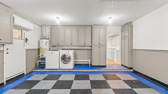 5010 Redstart St, Houston, TX 77035 - washroom featuring separate washer and dryer, a wall mounted AC, cabinet space, tile patterned floors, and gas water heater