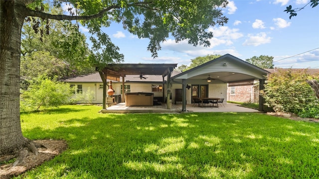 5010 Redstart St, Houston, TX 77035 - back of house featuring a hot tub, a ceiling fan, a yard, a patio, and brick siding