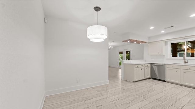 5010 Redstart St, Houston, TX 77035 - kitchen with stainless steel dishwasher, white cabinets, a peninsula, light countertops, and recessed lighting