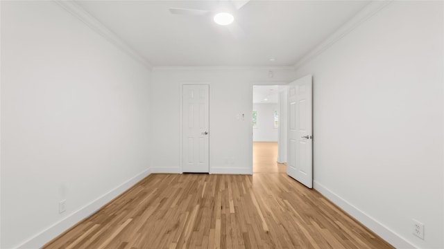 5010 Redstart St, Houston, TX 77035 - unfurnished bedroom with ornamental molding, light wood finished floors, and a ceiling fan