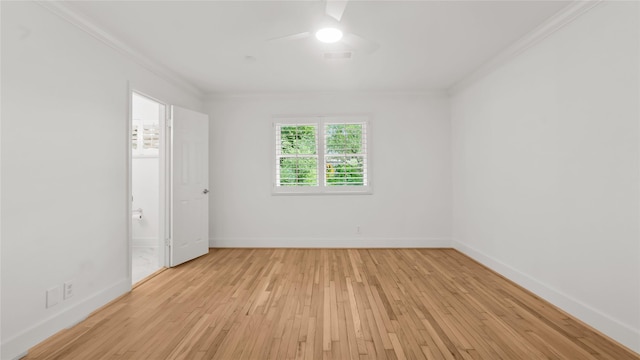 5010 Redstart St, Houston, TX 77035 - spare room featuring ornamental molding, a ceiling fan, and light wood-style floors