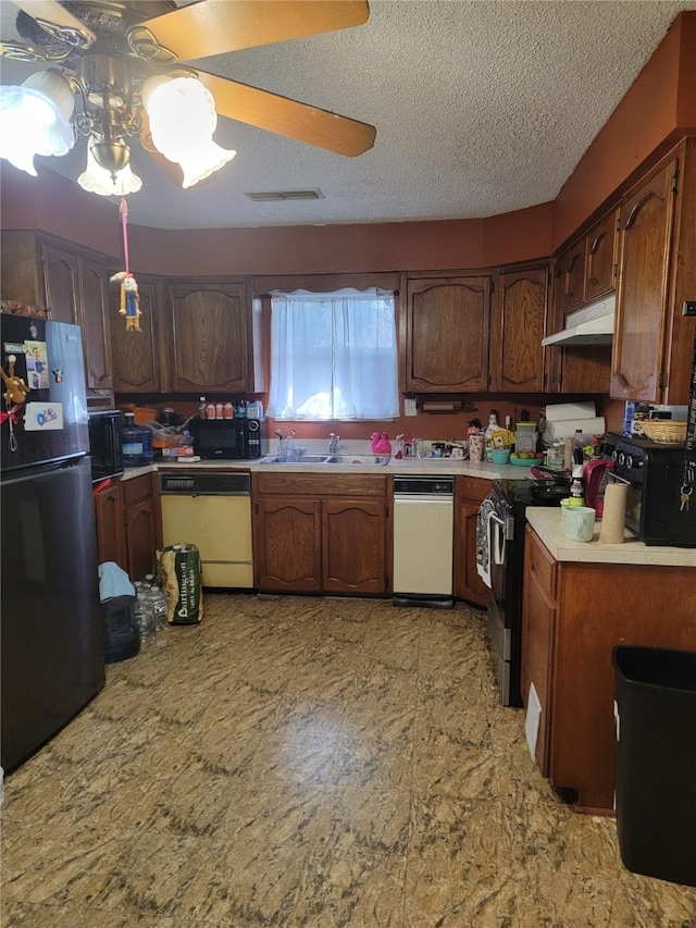 630 Alta Sita St, San Antonio, TX 78237 - kitchen featuring dishwasher, freestanding refrigerator, range with electric cooktop, light countertops, and under cabinet range hood