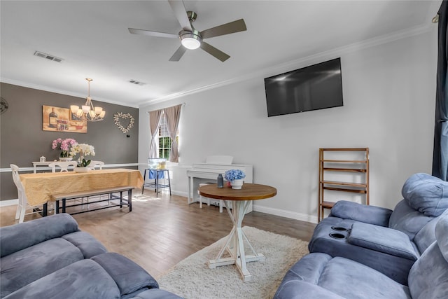 5506 Poundstone Ct, Sugar Land, TX 77479 - living room featuring a chandelier, ornamental molding, wood finished floors, and a ceiling fan