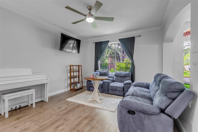 5506 Poundstone Ct, Sugar Land, TX 77479 - living room featuring ornamental molding, ceiling fan, and light wood-type flooring
