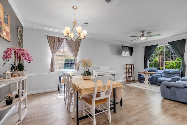 5506 Poundstone Ct, Sugar Land, TX 77479 - dining room with a chandelier, ornamental molding, light wood-style flooring, and a ceiling fan
