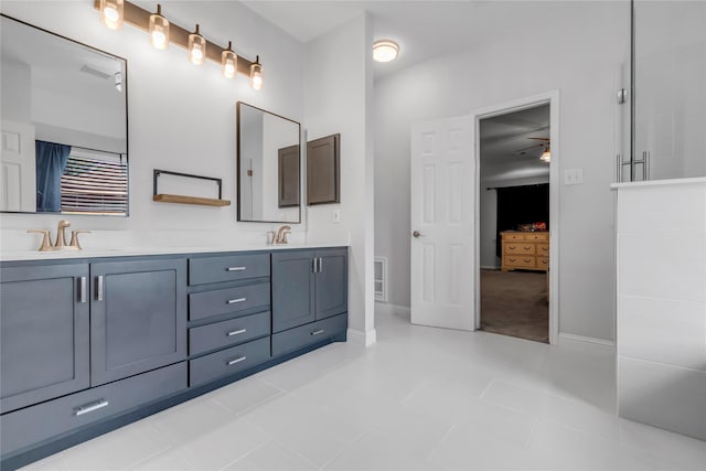 5506 Poundstone Ct, Sugar Land, TX 77479 - full bath featuring double vanity, connected bathroom, and ceiling fan