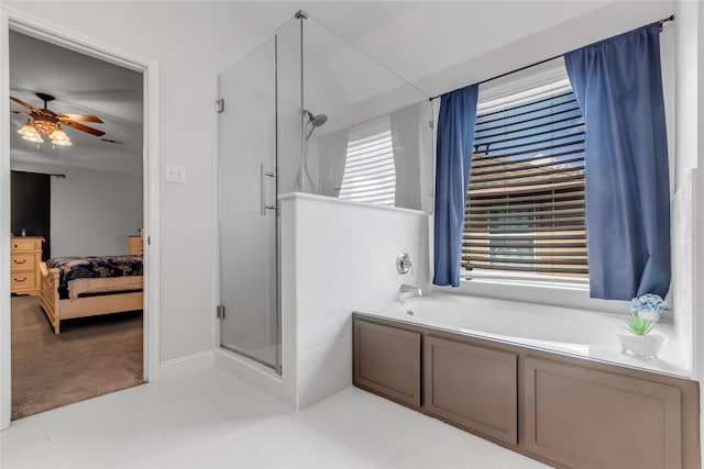 5506 Poundstone Ct, Sugar Land, TX 77479 - ensuite bathroom featuring ceiling fan, a stall shower, and a garden tub