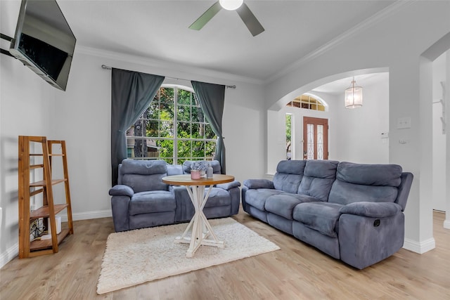 5506 Poundstone Ct, Sugar Land, TX 77479 - living room with arched walkways, crown molding, ceiling fan, wood finished floors, and french doors