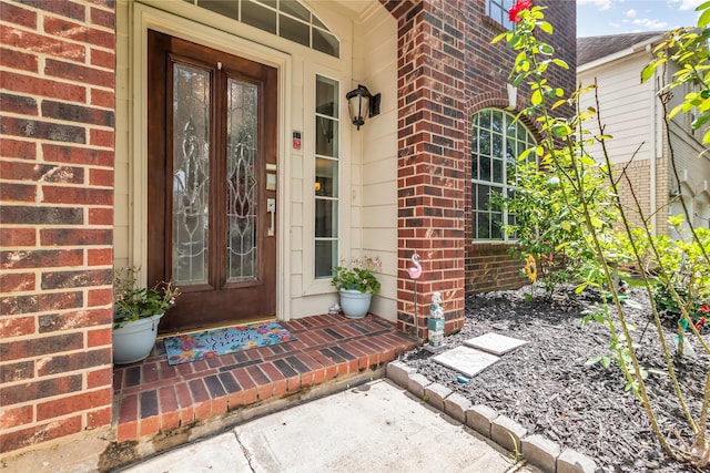 5506 Poundstone Ct, Sugar Land, TX 77479 - doorway to property with brick siding and a porch