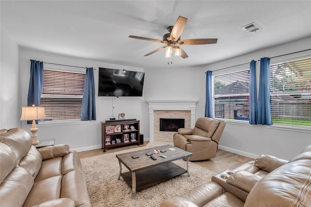 5506 Poundstone Ct, Sugar Land, TX 77479 - living area with a ceiling fan, a fireplace, and wood finished floors