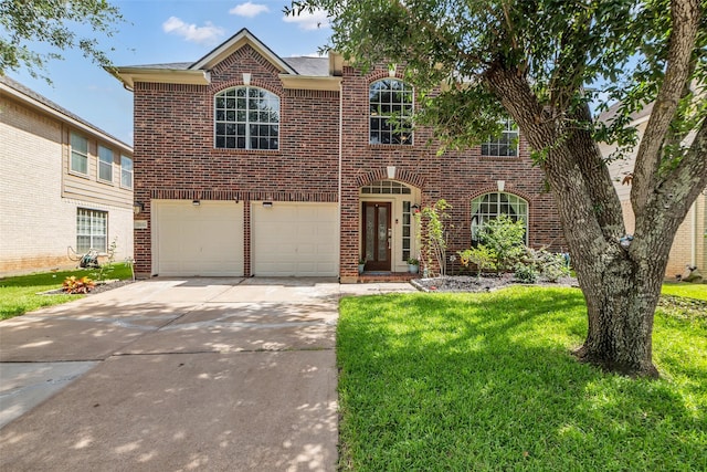 5506 Poundstone Ct, Sugar Land, TX 77479 - traditional-style home featuring brick siding, concrete driveway, a front lawn, and a garage